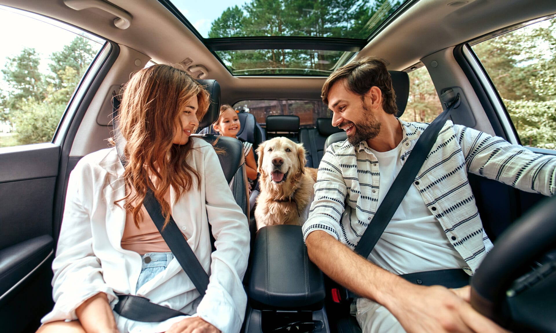 The whole family is driving for the weekend. Mom and Dad with th